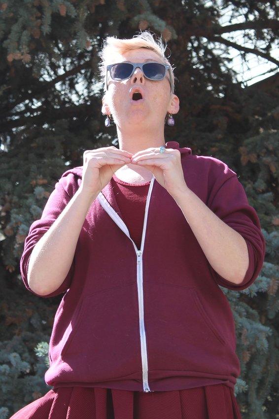 Georgetown's Tiffany Weber shouts and signs "no more victims" in American Sign Language during Saturday's rally for victims of the Idaho Springs Police Department in Citizens Park. Brady Mistic, a deaf man who was stunned and arrested by ISPD officers in 2019, has filed a lawsuit over the incident. Mistic attended Saturday's rally and asked that officers receive better training on how to interact with people who are deaf, handicapped, elderly, and more.